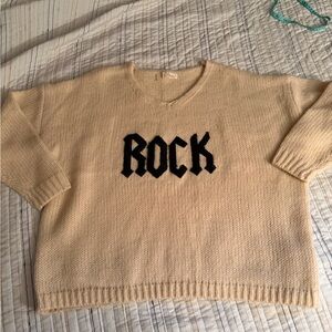 Elan Cream V-Neck Sweater with Black 'Rock' graphic